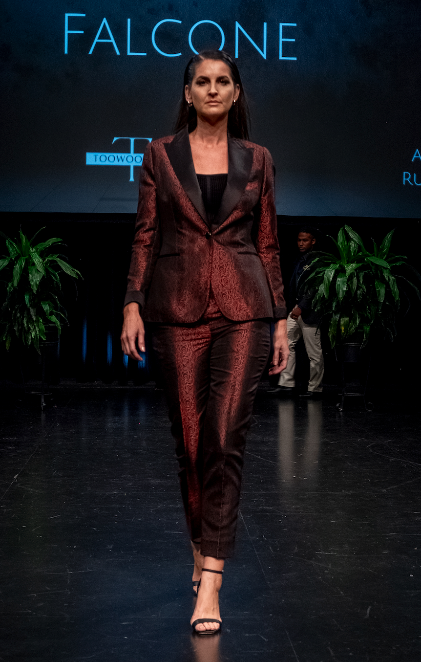 A model walks the runway wearing a matching metallic burgundy patterned blazer Women Tuxedo